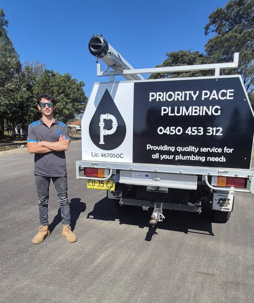 Priority Pace Plumbing plumber beside work ute